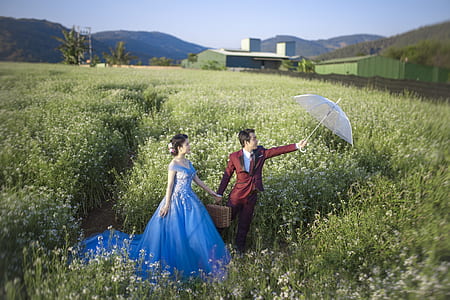 woman and man standing in flower field thumbnail