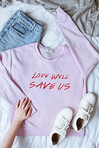 flat lay photography of purple sweatshirt and white low-top sneakers thumbnail