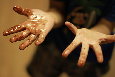 person's hands with black stain thumbnail