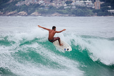 man surfing on waves thumbnail