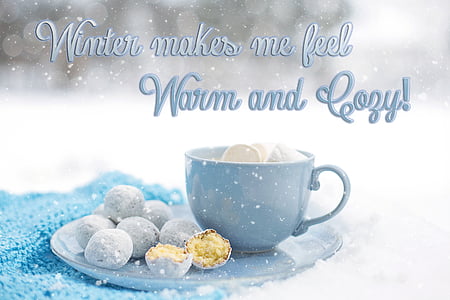 blue ceramic cup with bread balls on saucer with snow flakes background thumbnail