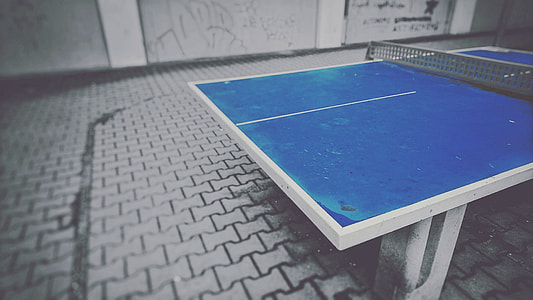 selective color photography of table tennis table thumbnail
