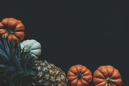 Photography of a Pineapple Fruit Near Two Squashes thumbnail