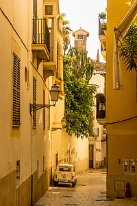 white vehicle parked on alleyway thumbnail