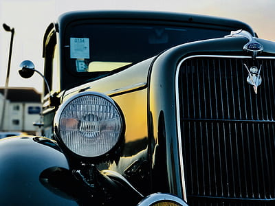 selective focus photo of classic black vehicle thumbnail