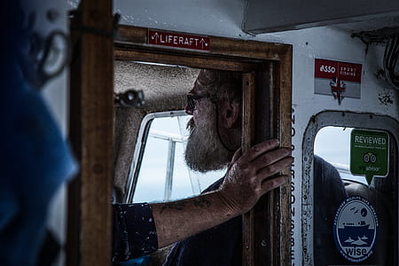 person holding on Lifecraft door thumbnail