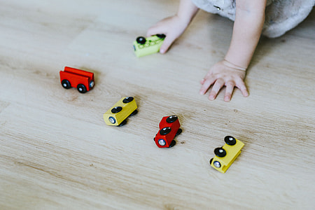 Child playing with toys on the floor thumbnail