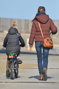 two woman on road under blue sky during daytime thumbnail