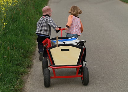 two children pulling wagon thumbnail