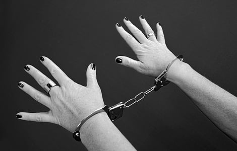 person showing hand with handcuffs thumbnail