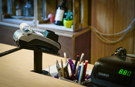 gray and black card terminal on brown desk thumbnail