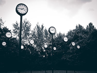 black analog clock post grayscale photo thumbnail