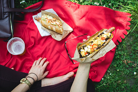 person holding hotdog sandwich thumbnail