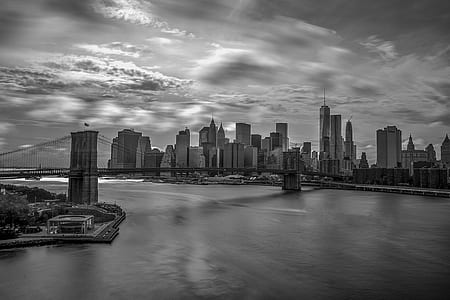 Grayscale Photography of City Buildings and Bridge thumbnail