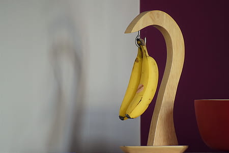 two bananas hanged on banana hook thumbnail