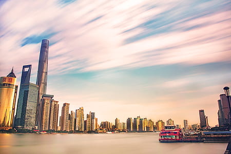 High-rise Buildings Near Body Of Water During Golden Hour thumbnail