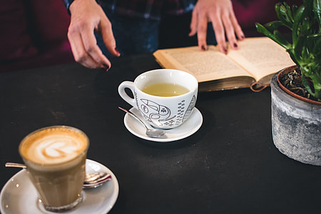 A cup of tea with a book thumbnail