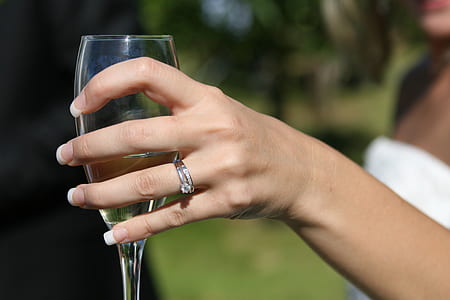 person holding flute glass thumbnail