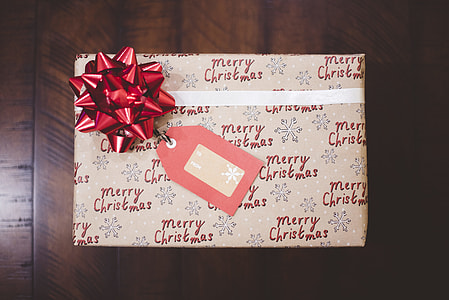 gray and red Christmas gift on brown surface thumbnail