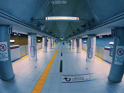empty underground station with white floor tiles thumbnail