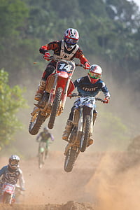 people having dirt bike racing during daytime thumbnail