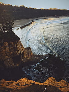 photo of waves crashing on shore during daytime thumbnail