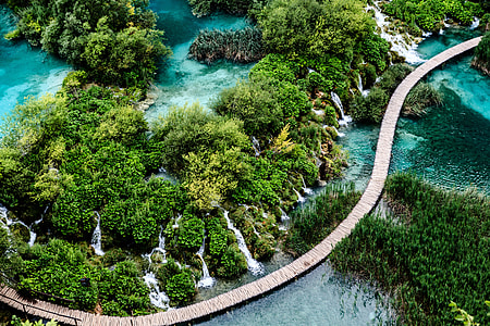 aerial view of bridge near waterfalls during daytime thumbnail