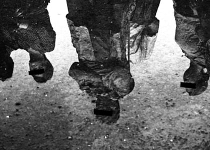 grayscale photograph of four people standing thumbnail