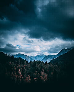 mountains under gray cloudy sky thumbnail