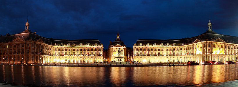 beige lighted house on body of water thumbnail