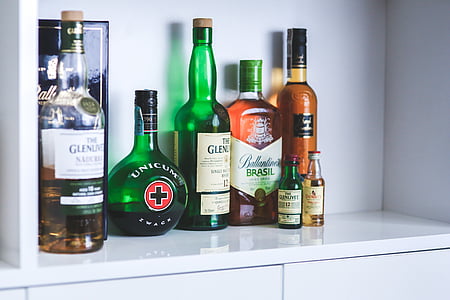 assorted-brand bottles on cabinet thumbnail
