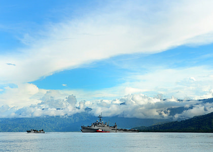 Sea and landscape off the coast in Papa New Guinea with US Transport ship thumbnail
