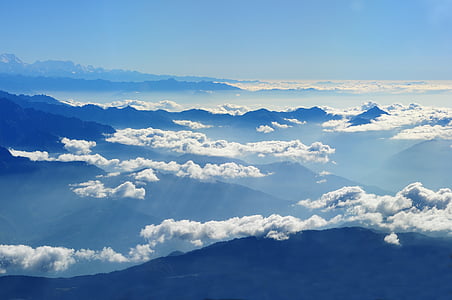aerial photography of mountain with clouds during daytime thumbnail