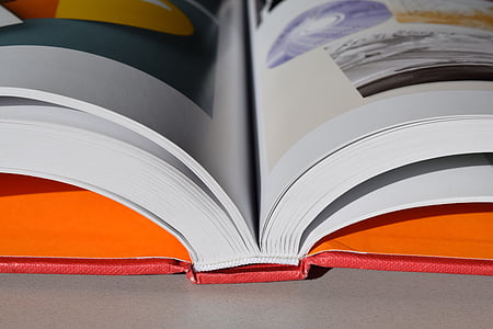 opened white book thumbnail