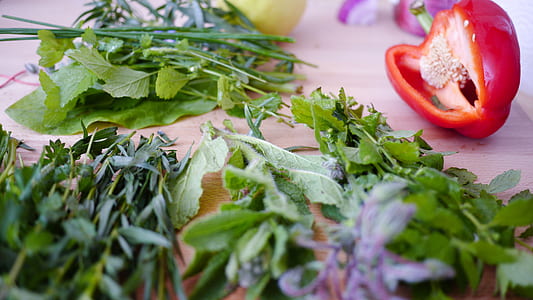 sliced bell pepper beside green leafed vegetable on top of the table thumbnail