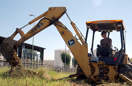 man riding on excavator thumbnail