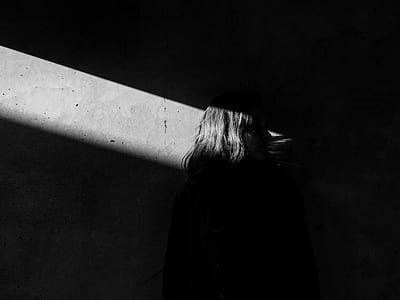 woman standing in front of concrete wall thumbnail