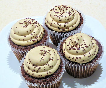 four brown cupcakes with green icings thumbnail