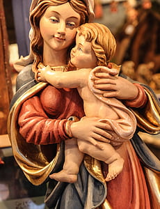 woman carrying child figurine thumbnail