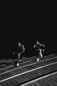 two men running on stairs thumbnail