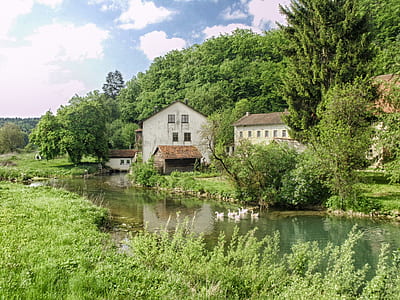 gray concrete house near water thumbnail