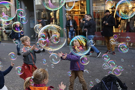 photography of kids playing with bubbles thumbnail