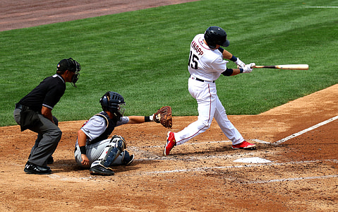 baseball players in field at daytime thumbnail