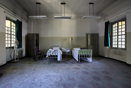 two empty bed inside white room thumbnail