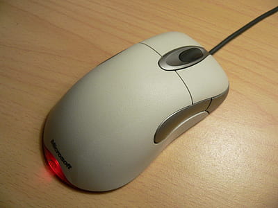 white Microsoft mouse on table thumbnail