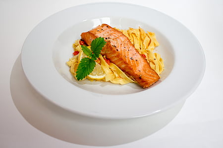 fried salmon on pasta on white surface thumbnail