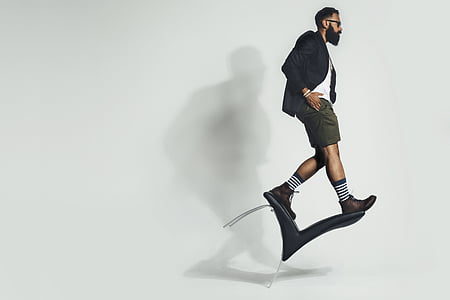 man standing on chair thumbnail