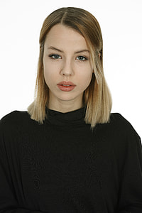 woman wearing black turtle-neck top thumbnail