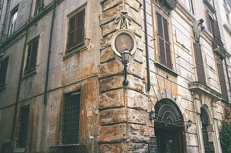 close-up photography of brown concrete building during daytime thumbnail