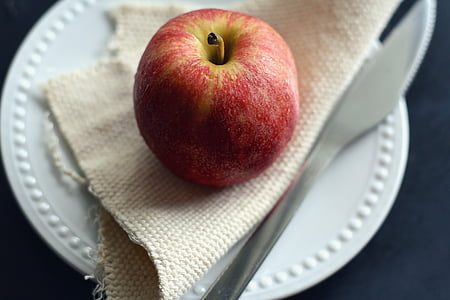 red apple on beige textile thumbnail